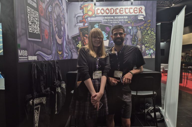 Das Entwicklerteam vor dem Bloodletter-Stand in der gamescom-Indiehalle.